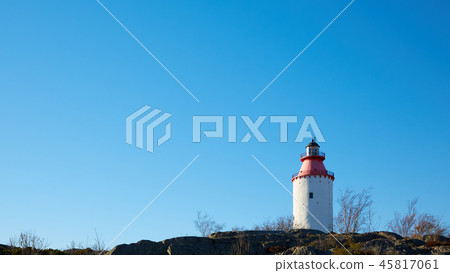 Lighthouse in Swedish village Landsort on the island of Oja Lighthouse in Swedish village Landsort on the island of Oja 45817061