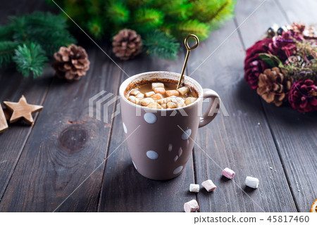 Hot cappuccino with marshmallows in a ceramic cup with honey and metal honey stick on a wooden dark Hot cappuccino with marshmallows in a ceramic cup with honey and metal honey stick on a wooden dark 45817460