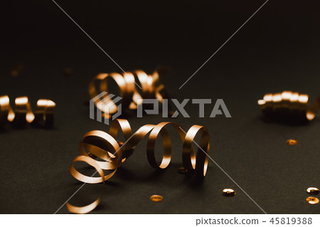 Minimalistic golden decor on black stylish background. 45819388