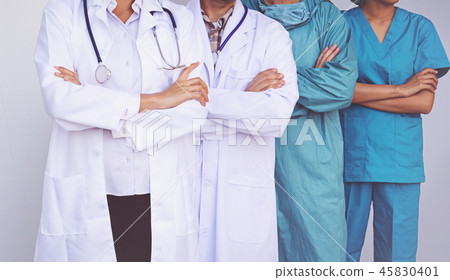 Doctors and Nurses coordinate hands.  45830401