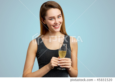 Beautiful girl with a glass of champagne  Beautiful girl with a glass of champagne  45831520