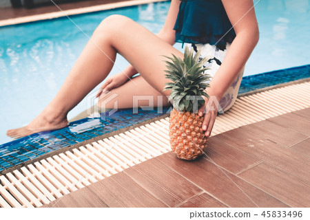 Close-up portrait of woman holding pineapple  45833496