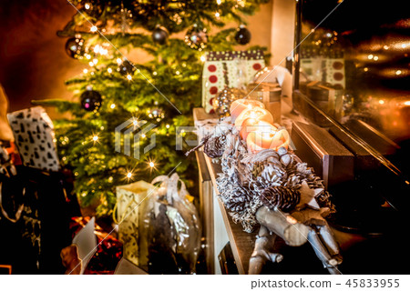 four burning advent candles, beautiful decorated setup lights in Background christmas tree with four burning advent candles, beautiful decorated setup lights in Background christmas tree with 45833955