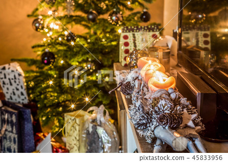 four burning advent candles, beautiful decorated setup lights in Background christmas tree with four burning advent candles, beautiful decorated setup lights in Background christmas tree with 45833956