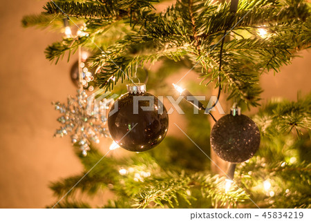 Christmas background of de-focused lights decorated tree illuminated moody Christmas background of de-focused lights decorated tree illuminated moody 45834219