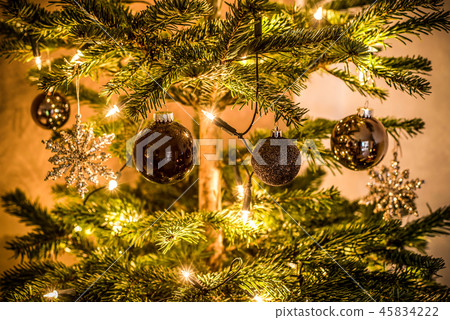 Christmas background of de-focused lights decorated tree illuminated moody 45834222