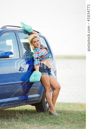 young sexy woman washes the car 45834771