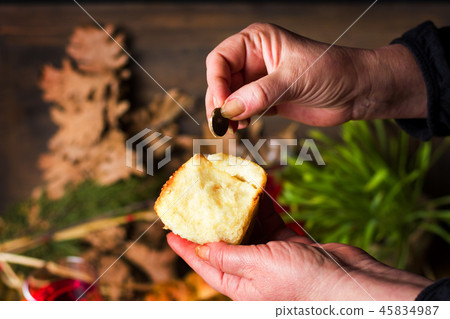Finding coin in Orthodox Christmas eve bread Finding coin in Orthodox Christmas eve bread 45834987