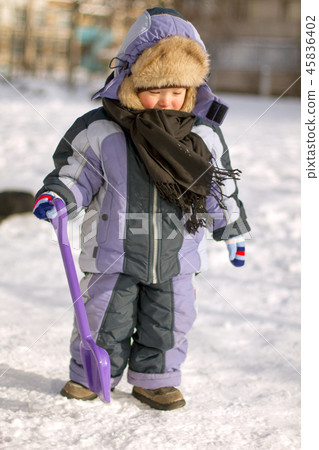 Boy enjoying the first snow 45836402