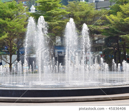 The fountain is blasting up high. 45836406