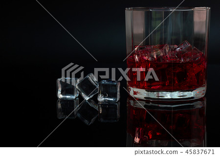 Polygon glass and reflection of liquor and ice. 45837671