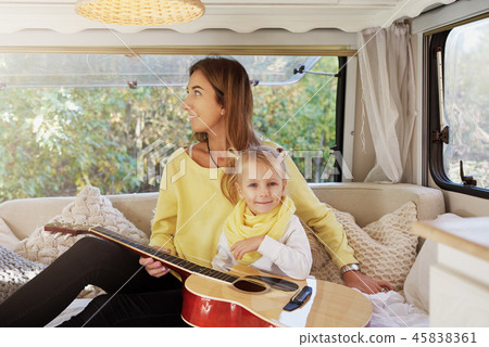 A child of four plays the guitar. A child of four plays the guitar. 45838361