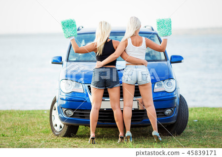 two girls wash the car 45839171