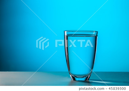 Glass on dark blue background 45839300