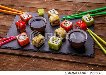 Sushi Set rolls with soy sauce served on gray stone slate 45839370