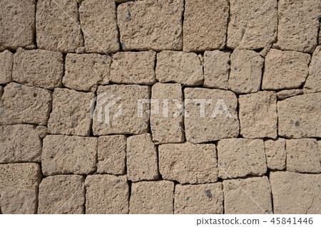 ignimbrite stone  natural stone wall background 45841446