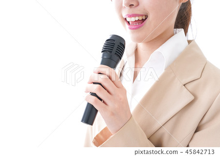 A woman talking with a microphone A woman talking with a microphone 45842713