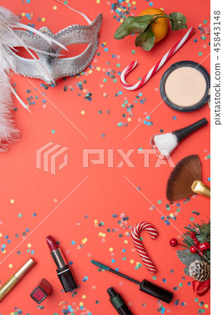 Photo on top of brushes, feather mask, tangerine, sugar cane 45843148