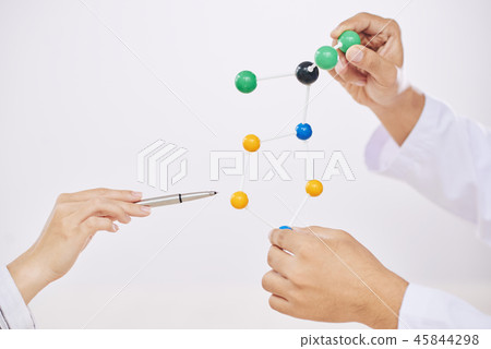 Crop scientists with molecular model on white background Crop scientists with molecular model on white background 45844298
