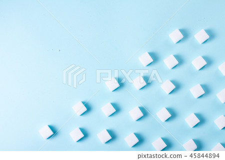 Sugar on blue background Sugar on blue background 45844894