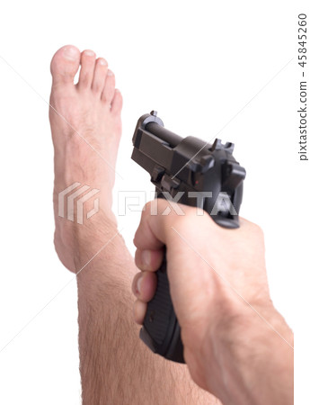 Man shooting himself in the foot 45845260