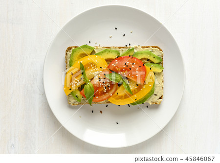 Avocado and tomato toast on plate with copy space Avocado and tomato toast on plate with copy space 45846067