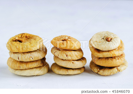 Stacks of dried figs on white backdrop Stacks of dried figs on white backdrop 45846070