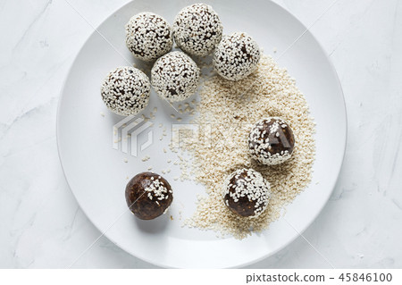 Energy ball on plate in sesame seeds 45846100