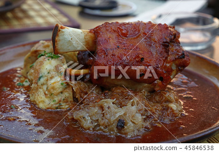 Portion of roasted pork shank with dumplings Portion of roasted pork shank with dumplings 45846538