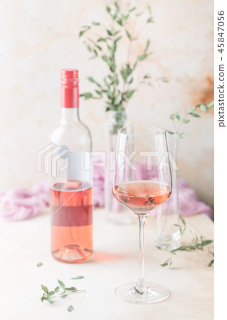 Glass and bottle of rose wine 45847056