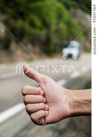 young man hitchhiking 45847364