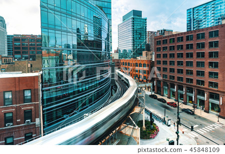 Elevated train curving through Chicago 45848109