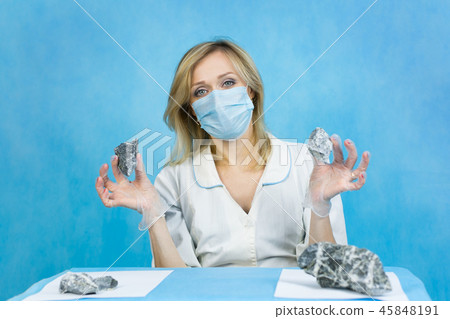 The girl laboratory technician examines samples of The girl laboratory technician examines samples of 45848191