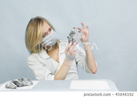 The girl laboratory technician examines samples of The girl laboratory technician examines samples of 45848192