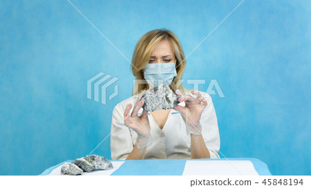 The girl laboratory technician examines samples of The girl laboratory technician examines samples of 45848194
