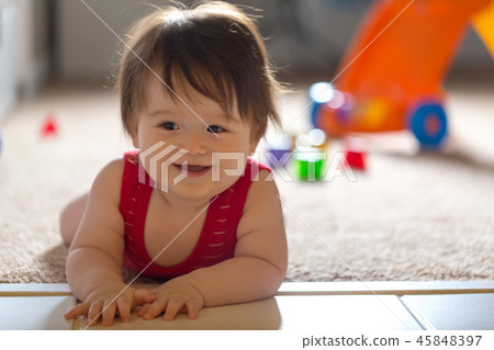 Happy boy playing with his toys 45848397