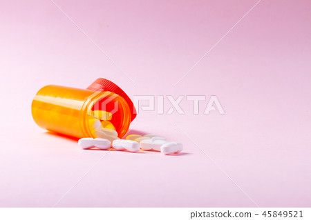 White pills on blue background 45849521