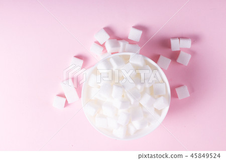 Sugar on pink background Sugar on pink background 45849524
