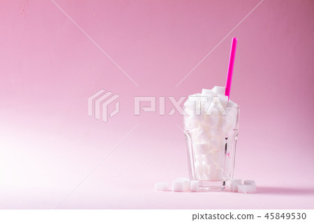 Sugar on pink background Sugar on pink background 45849530