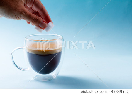 To cubes of sugar in spoon To cubes of sugar in spoon 45849532