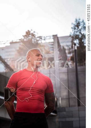 Joyful positive sportsman being in a good mood Joyful positive sportsman being in a good mood 45851581