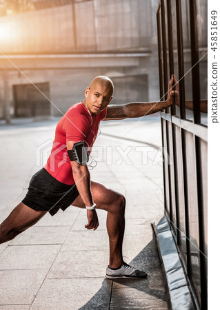 Nice handsome young man stretching his body 45851649