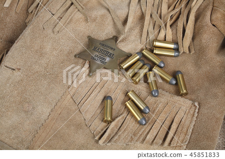 Wild west period ammunition and sheriff badge Wild west period ammunition and sheriff badge 45851833