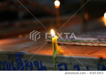 candles burning brightly on black background 45851953