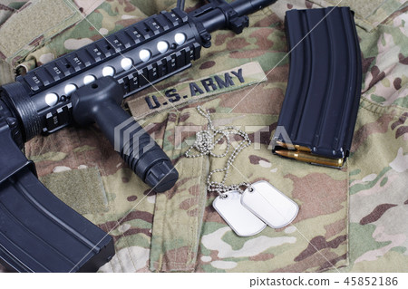 M4 carbine with ammunition on US Army uniform M4 carbine with ammunition on US Army uniform 45852186