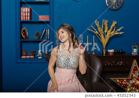 Very beautiful woman drinking champagne in new Very beautiful woman drinking champagne in new 45852343