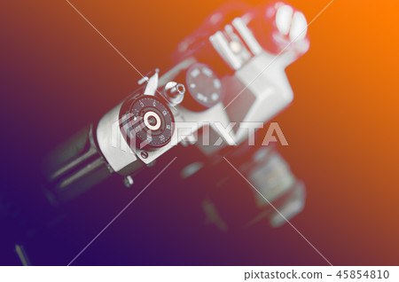 Old analog camera in black and silver tones Old analog camera in black and silver tones 45854810