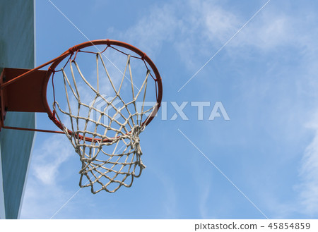 Basketball hoop and bright sky. 45854859