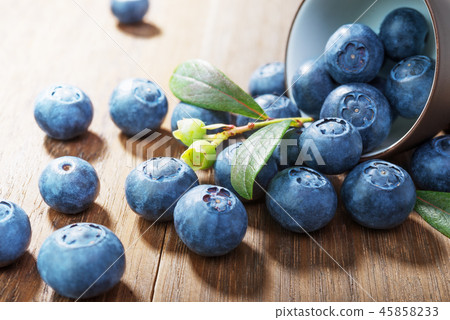 Blueberries on rustic wooden background Blueberries on rustic wooden background 45858233