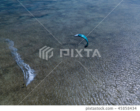 Aerial views, top view of kitesurfing on the waves Aerial views, top view of kitesurfing on the waves 45858434